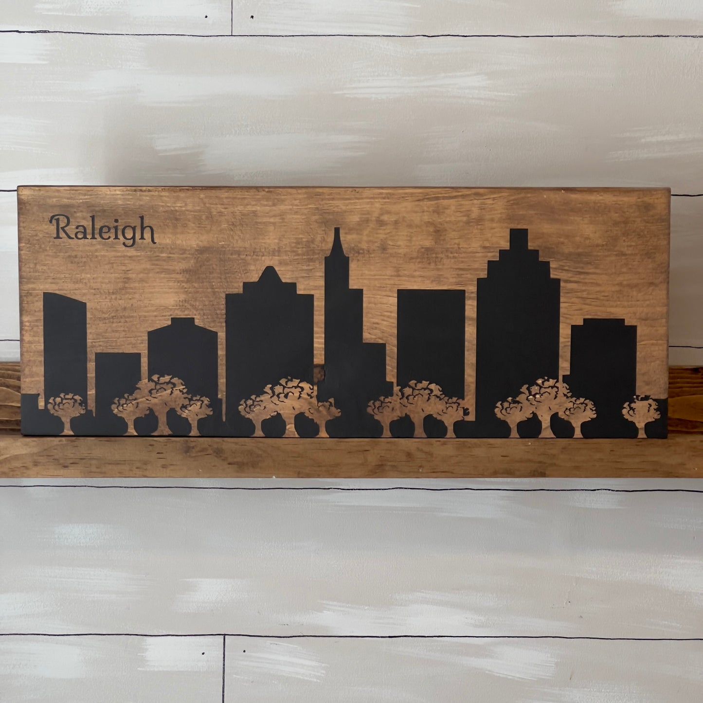 Raleigh w/ Trees Skyline Sign